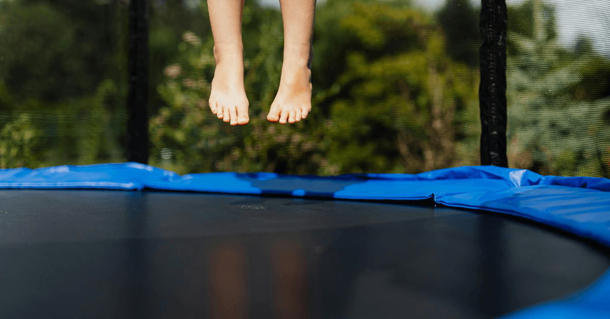 Kid jumping on trampoline