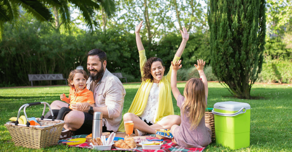 Family having a picnic at one of the play parks in cape town
