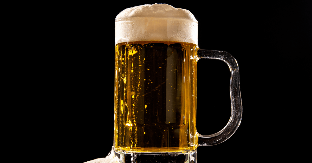Stella Artois lager in a beer mug with a golden colour and foamy head 