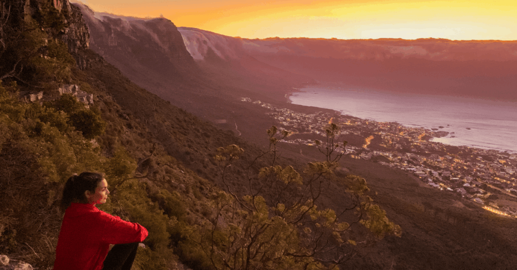 A person admiring the sunset view from Kloof Corner