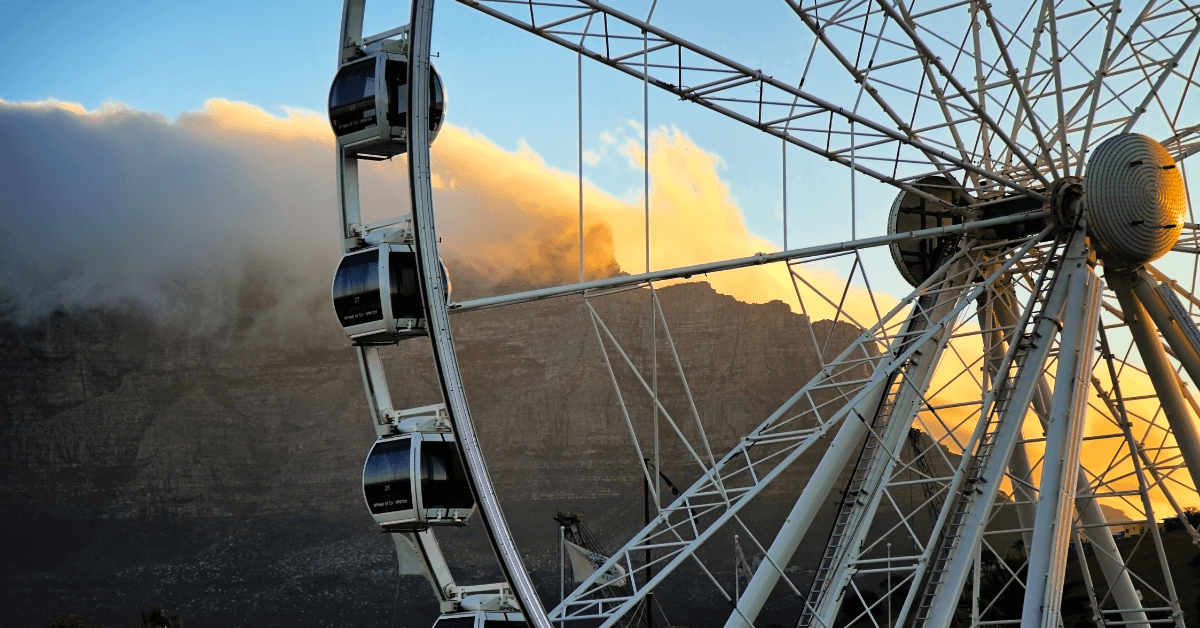 View of the Cape Wheel and Table Mountain from the V&A Waterfront at sunset 