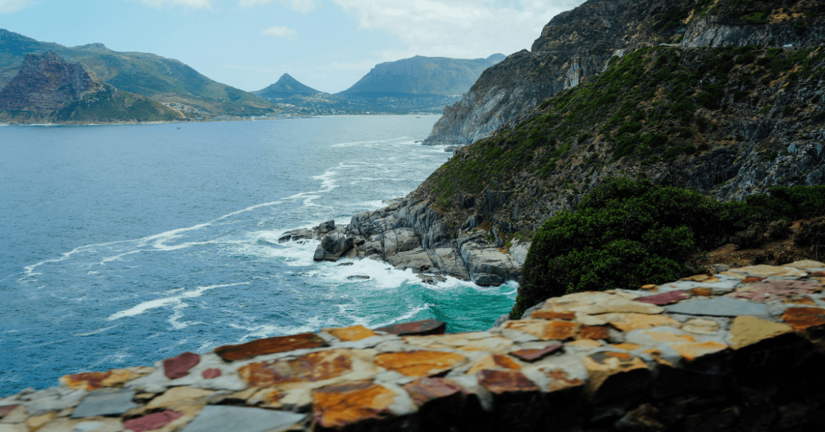 View from Chapmans Peak drive of the mountains and the ocean in Cape Town
