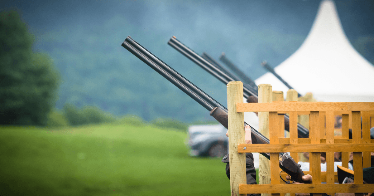Fun Year-End Function Ideas - Group of colleagues taking part in a clay pigeon shooting experience 